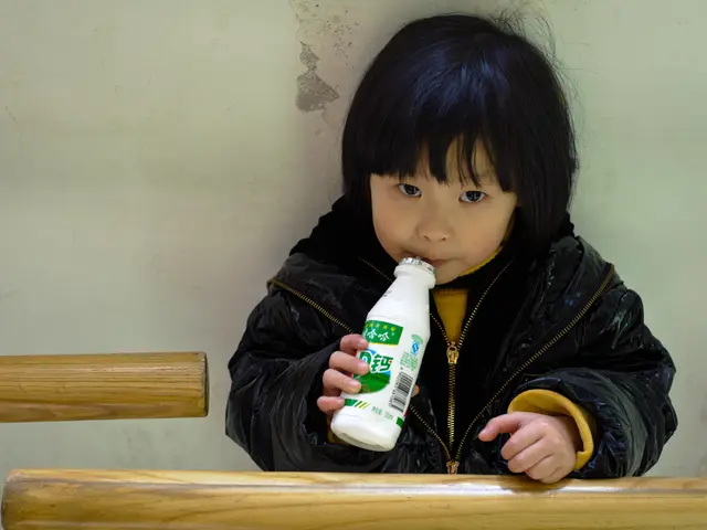 Child purchases ice cream for one child, while another goes without