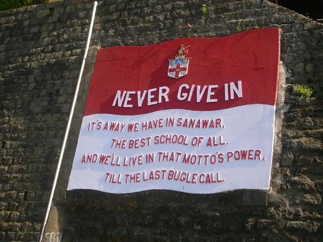 There is a board in the center of the image on the wall, there is some text on it, there is a pipe...